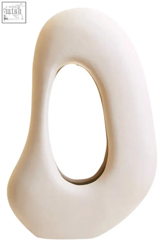 Hapax abstract cream sculpture is a cream sculpture with a smooth cream finish and an oval cutout design