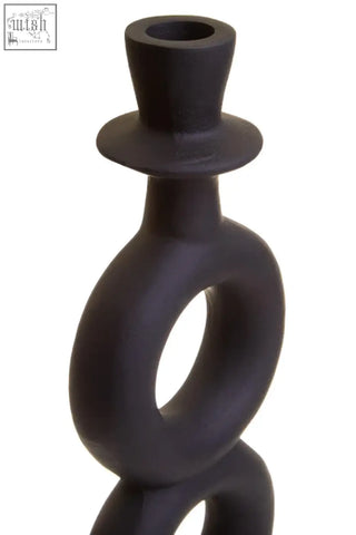 Hapax large black candle holder in matte black ceramic with top hat finial and interlocking ring design