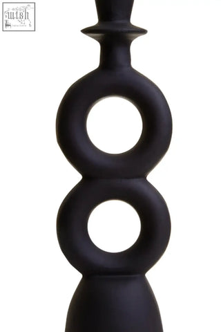 Hapax large black candle holder made of matte black ceramic with stacked circular rings for candles