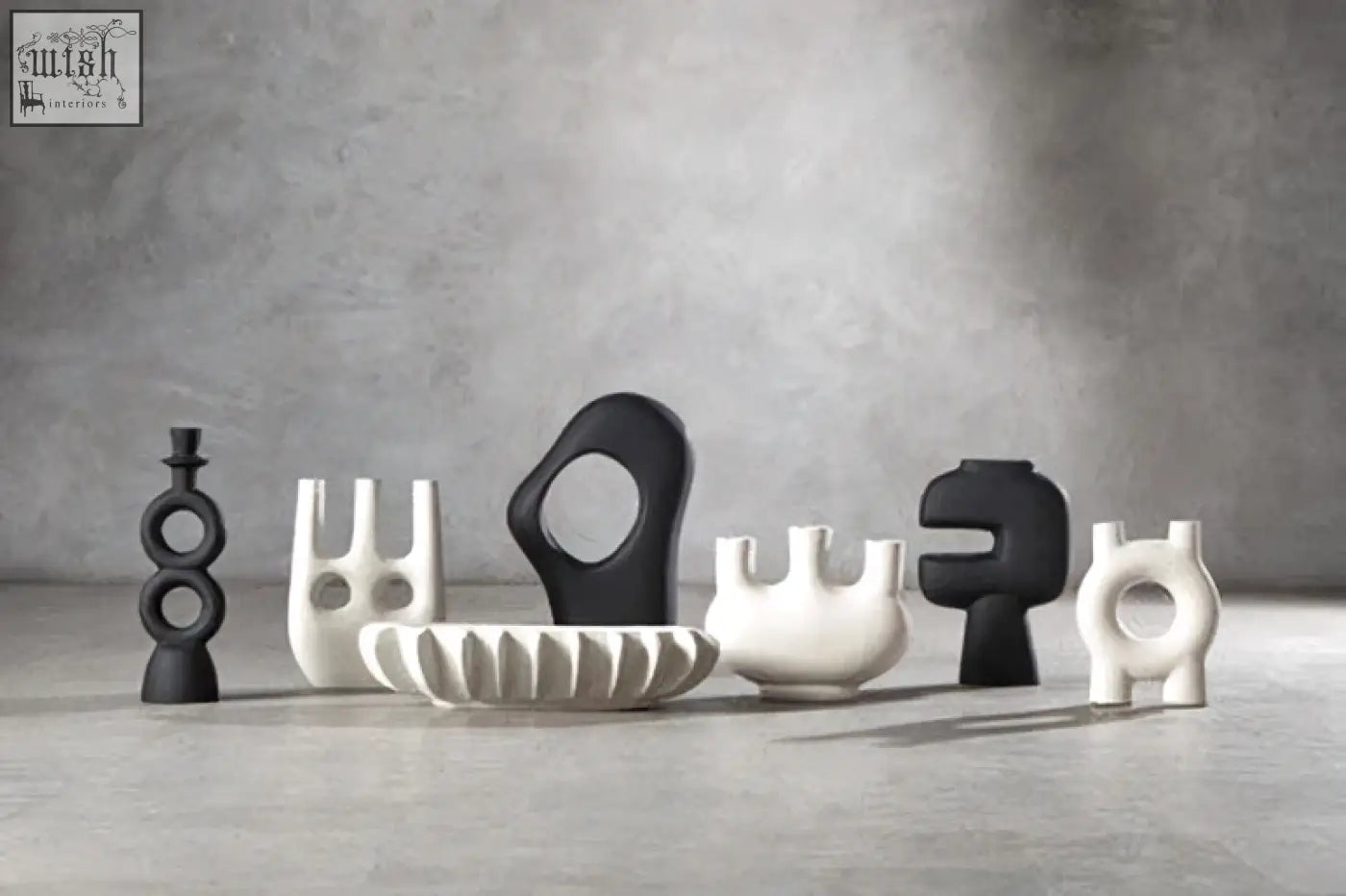 A sleek large black candle holder with matte black and glossy ceramic accents perfect for stylish candle displays