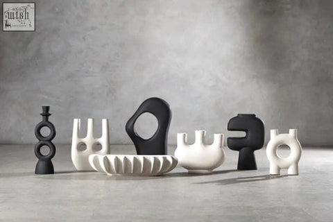 A sleek large black candle holder with matte black and glossy ceramic accents perfect for stylish candle displays