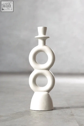 White ceramic abstract candle holder with stacked circular rings and top hat finial for large cream candle holder