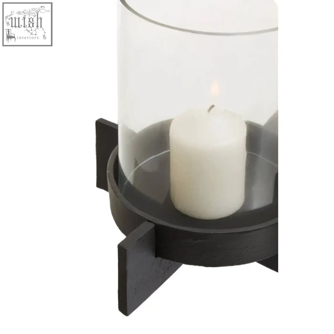 Hapax large matt black finish candle holder with clear glass cylinder housing a white pillar black finish candle