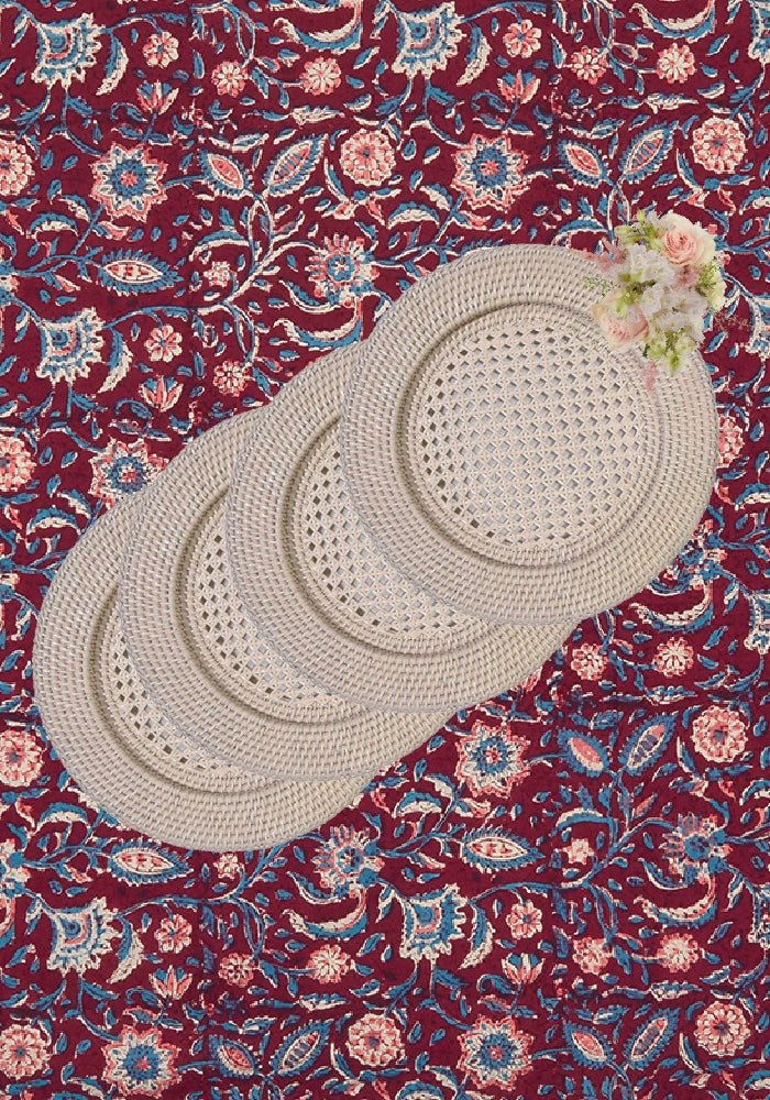Beige woven harbour island rattan round charger placemats with circular perforated design set of 4