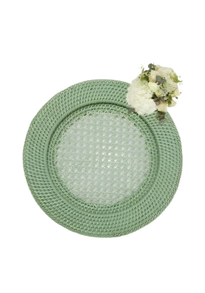 A set of 4 harbour island round rattan chargers in mint green with a textured diamond pattern and braided rim