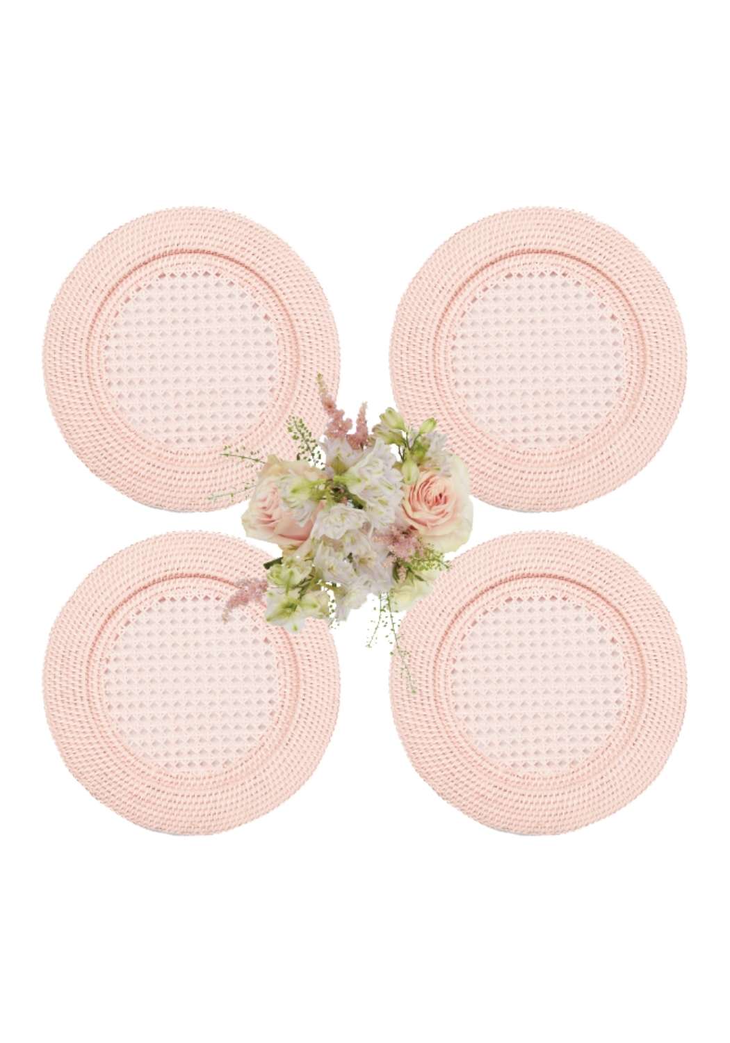 Set of four blush pink harbour island round rattan charger placemats with textured basket weave pattern