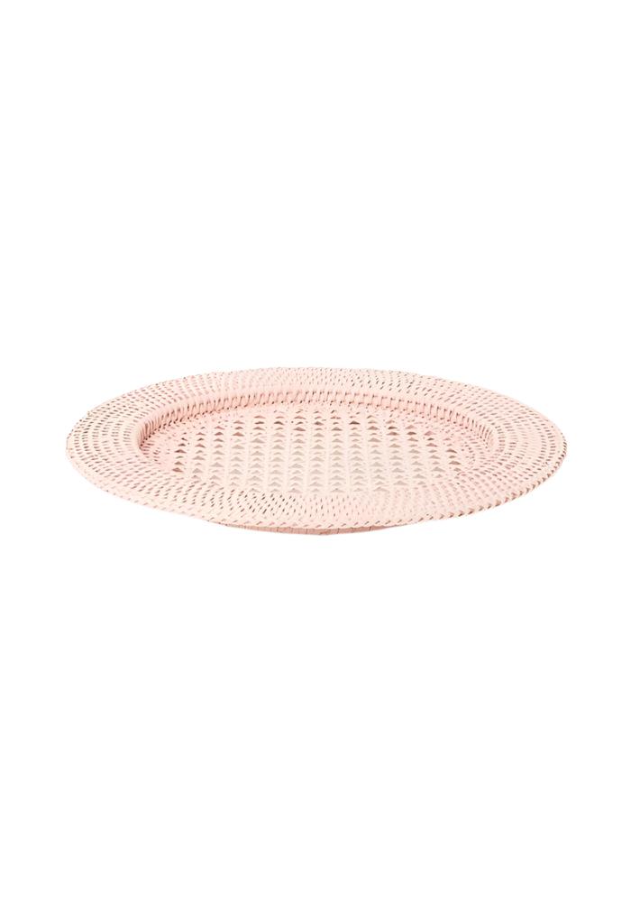 A delicate pink woven harbour island round rattan charger placemat with a textured interlaced pattern set of 4