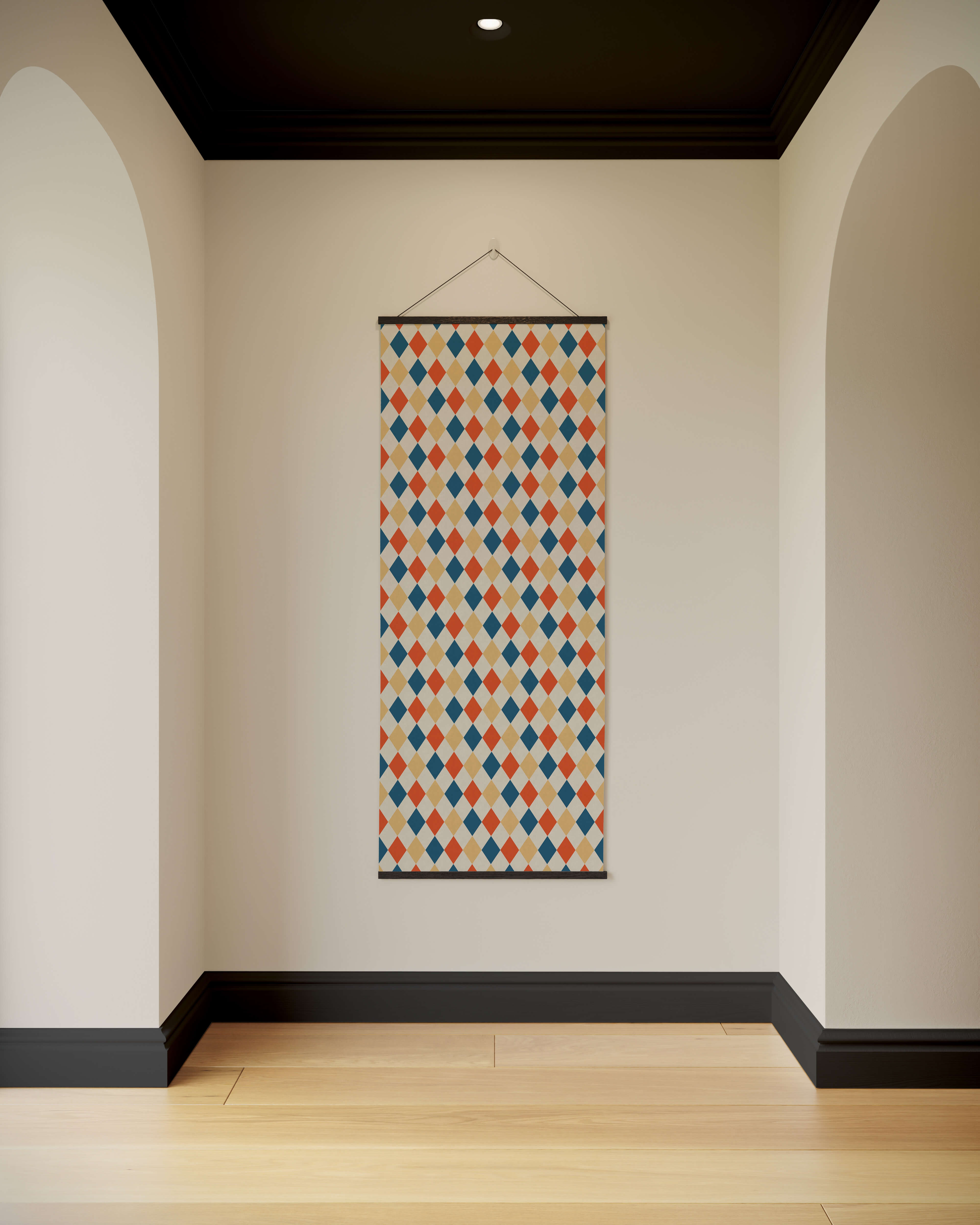 A rectangular harlequin pattern tapestry with orange blue and beige diamond shapes on a light background