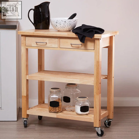 Light-colored hevea wood kitchen trolley with black caster wheels features two drawers and three shelves for storage