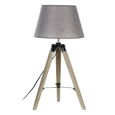Harper grey tripod table lamp with a grey textured lampshade on a light wood tripod table base with black metal joints