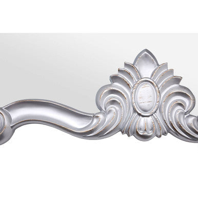 Harriet silver wall mirror with a silver ornate frame featuring intricate floral and scrollwork design