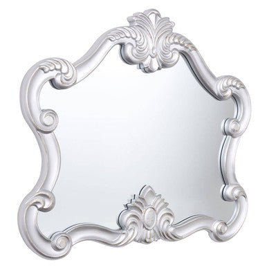 Harriet silver wall mirror featuring an ornate silver frame with intricate scrollwork and floral detailing