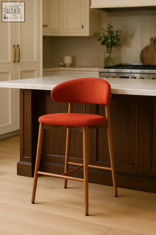 Vibrant orange haruto bar stool with slender wooden legs and modern curved backrest perfect for bars or kitchens