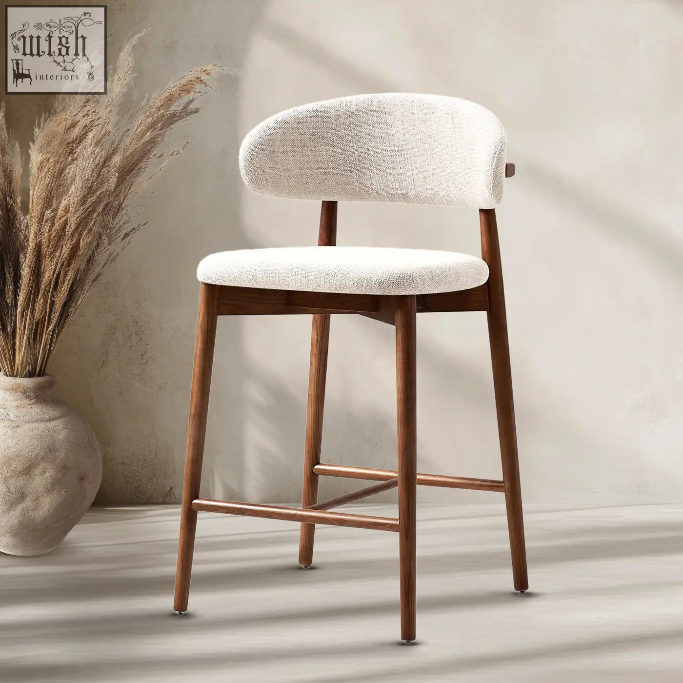 A modern haruto bar stool with white textured fabric seat and backrest on sleek dark wood legs
