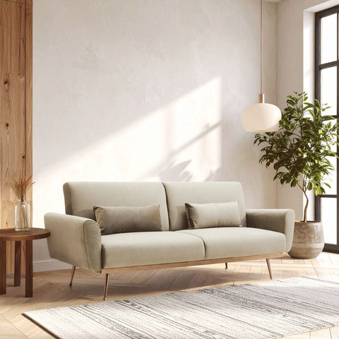 Beige hatton mink velvet sofa bed with wooden legs and matching throw pillows in mink velvet upholstery