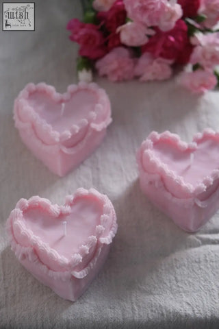 Pink heart cake candle with delicate ruffled edges and a smooth glossy finish perfect for cakes and decor