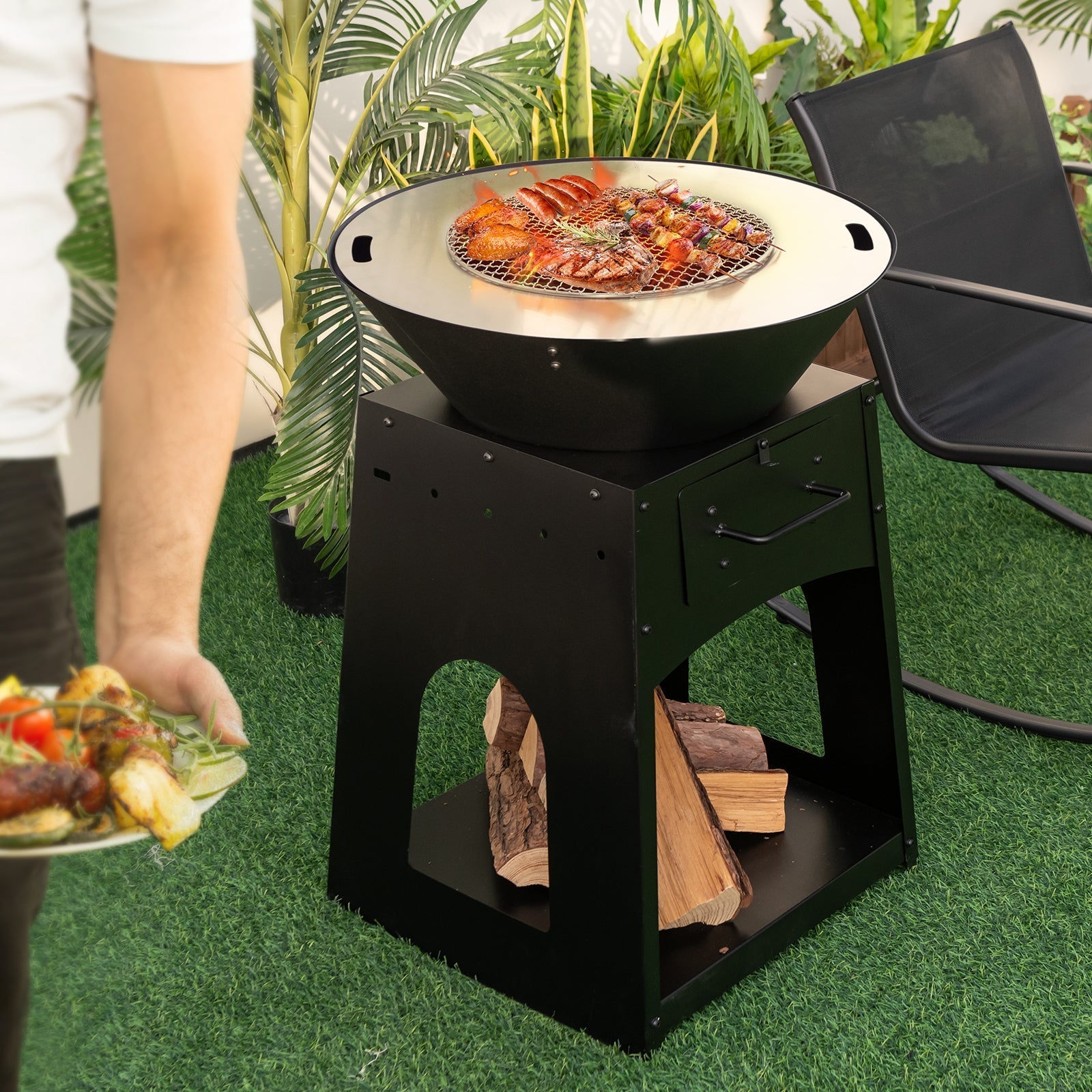 Black metal heavy duty fire pit grill with round cooking surface and wood storage rack made of premium galvanized metal