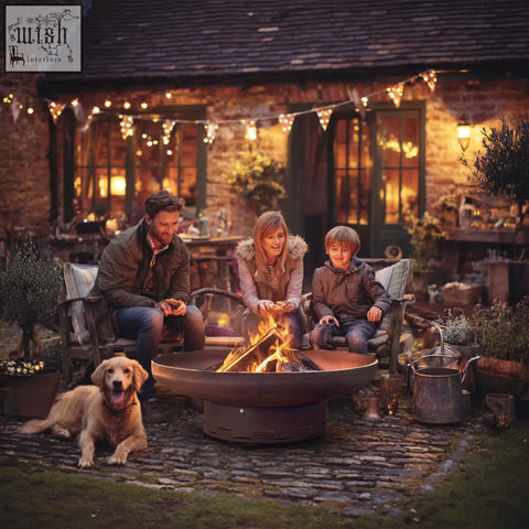 Rustic bronze nicoman heavy-duty pre-rusted corten steel firepit with circular bowl design and visible flame activity