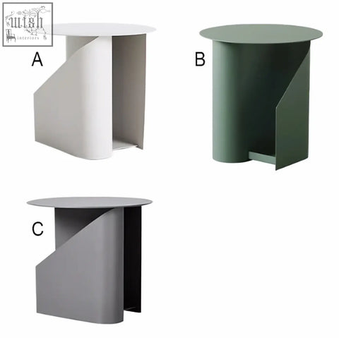 Hector side table with book storage features a matte white painted steel curved base and flat circular top