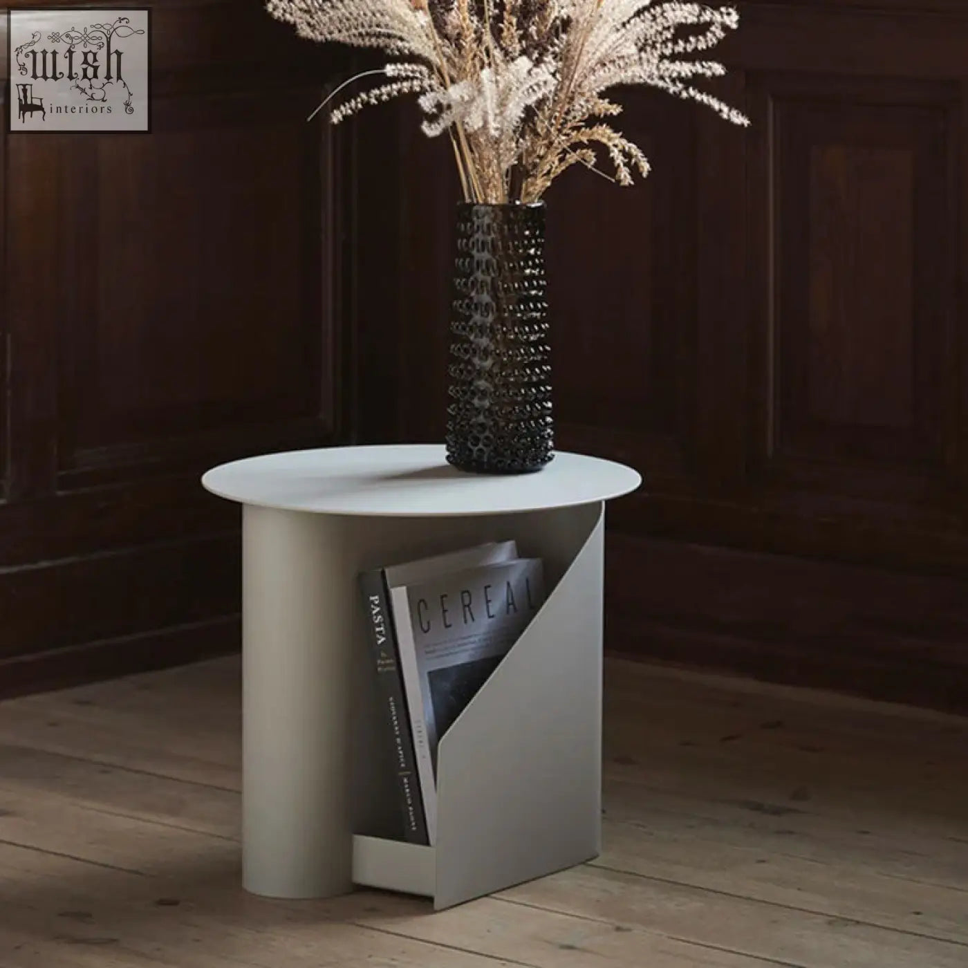 Matte white hector side table with painted steel base and integrated book storage for magazines and books