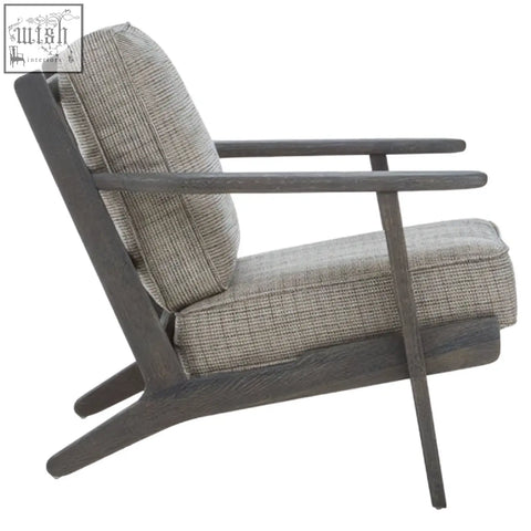 Gray tweed armchair with black oak wood frame featuring woven fabric seat and backrest with dark oak wood legs and arms