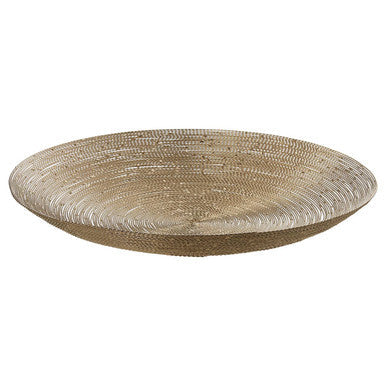 A round woven basket with a natural beige hue shown as a decorative plate with nickel twisted wire details