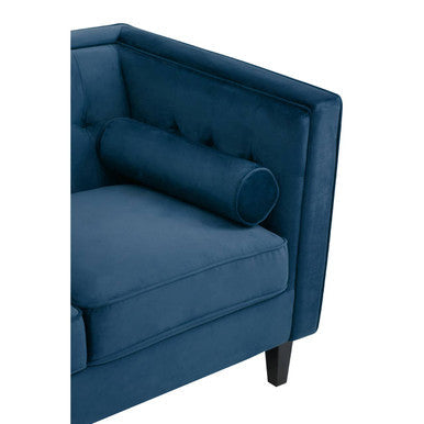 Deep blue velvet armchair with matching cylindrical bolster pillow part of helia 3 seat blue velvet sofa
