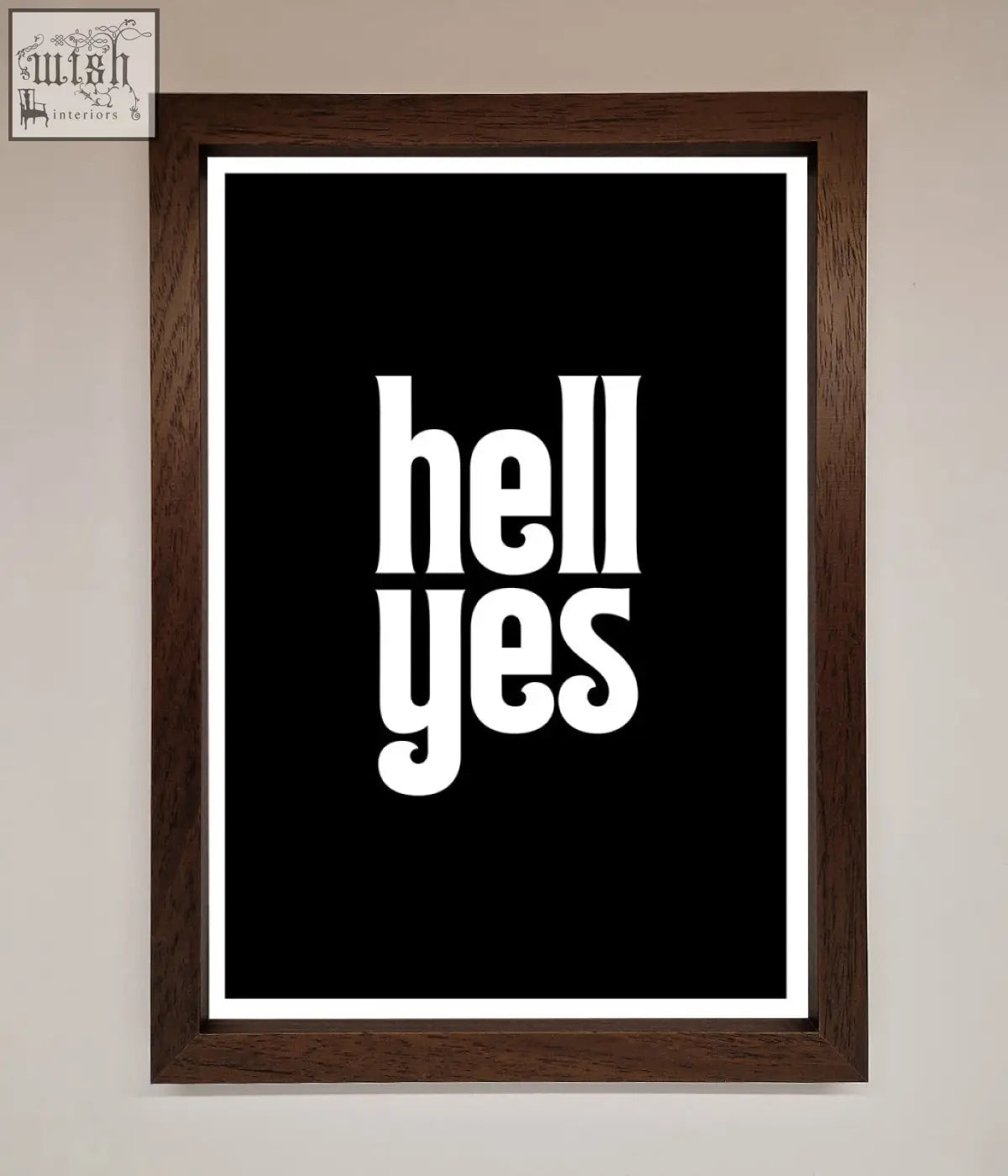 A framed print featuring bold black and white hell yes text in a dark brown wooden frame offering stylish frame choices