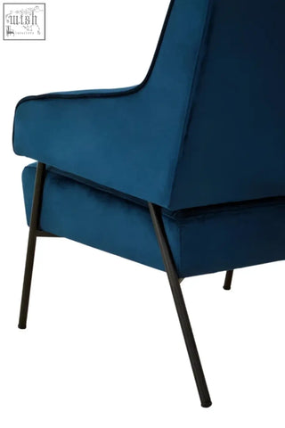 Deep blue velvet henia blue velvet chair with sleek black metal legs perfect for stylish comfy seating