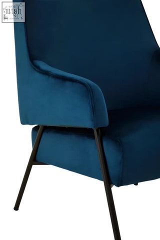 Deep blue henia blue velvet chair with sleek black metal legs perfect for stylish living spaces
