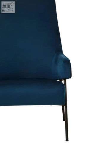 Henia blue velvet chair with deep blue velvet upholstery and sleek black metal legs for stylish seating
