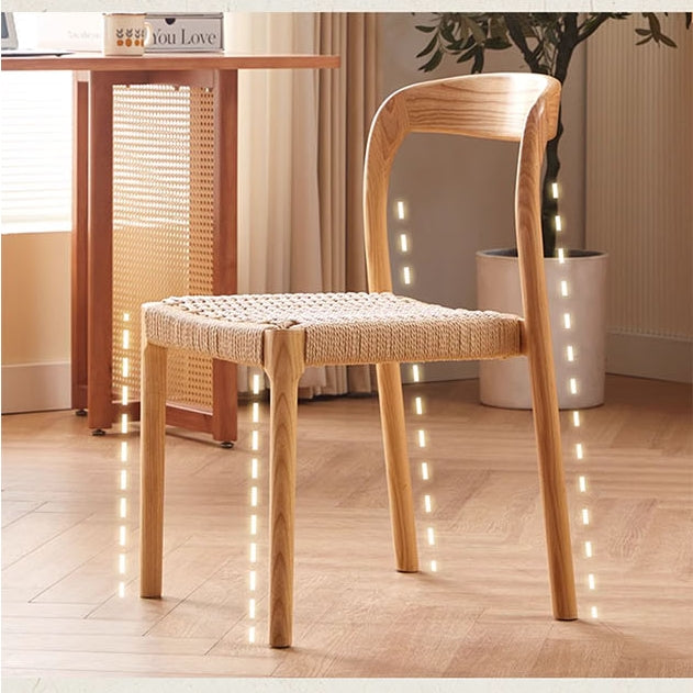 Henry dining chair with light wood frame and woven rattan seat featuring a curved backrest perfect for dining