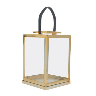 Herber small gold steel lantern with clear glass panels and a black leather handle for easy carrying