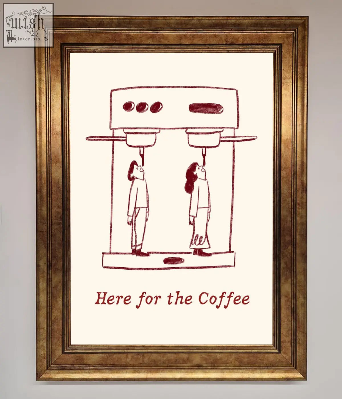 A gold-toned coffee framed print featuring two stylized figures under a coffee machine with here for the coffee text
