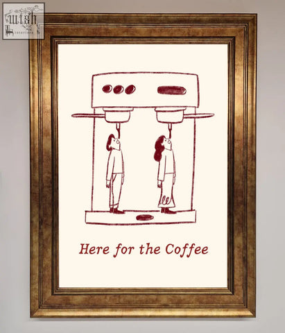 A gold-toned coffee framed print featuring two stylized figures under a coffee machine with here for the coffee text