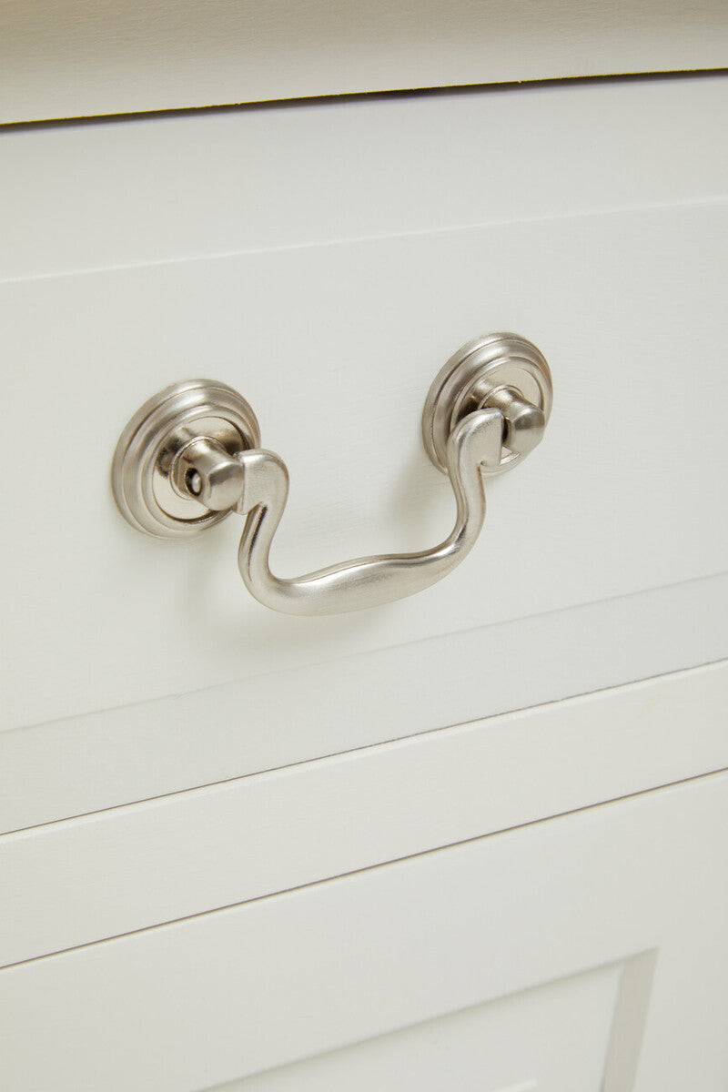 Silver-toned curved drawer pull with polished finish on heritage 2 drawer white sideboard drawer white sideboard