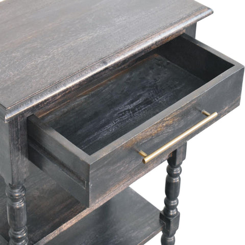 Dark gray distressed solid mango wood end table with turned legs and single smooth-glide drawer in carbon ash finish