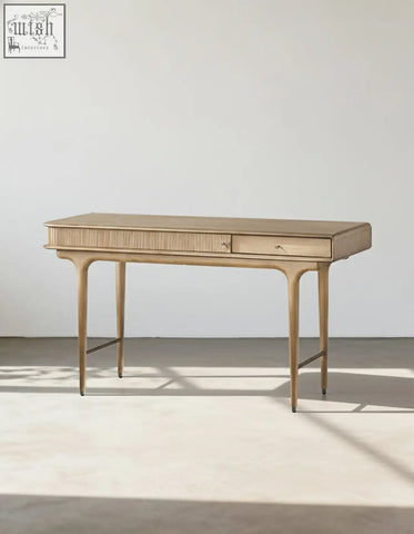 A sleek hermosa e10 office desk in light wood with a minimalist design and slender legs perfect for any office space