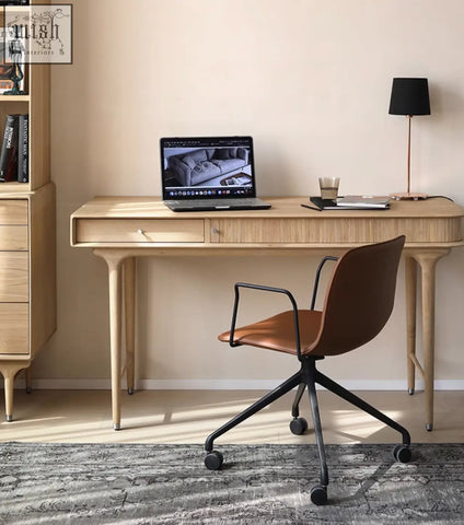 A sleek minimalist wooden office desk with a single drawer and tapered legs from hermosa e10 office collection