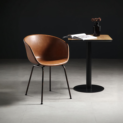 Herron a set of 2 dining chairs featuring brown leather armchair style seats with sleek black metal legs