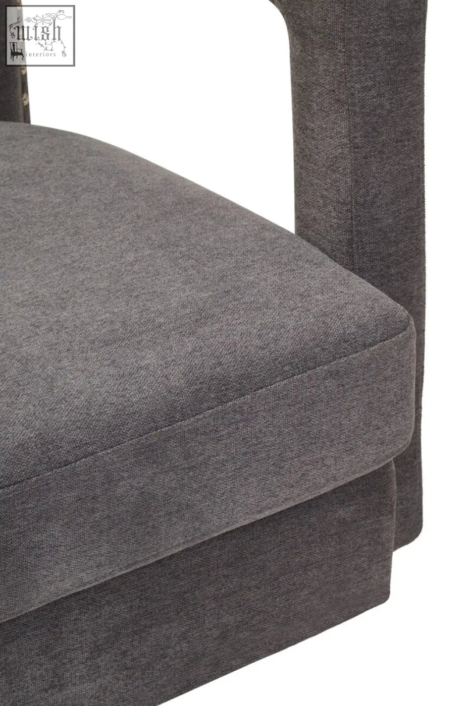Dark gray hestia ash velvet swivel chair with textured fabric and subtle nailhead trim on the armrest