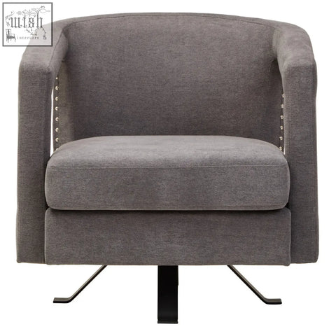Gray upholstered hestia ash velvet swivel chair with studded accents and black metal base for sleek seating