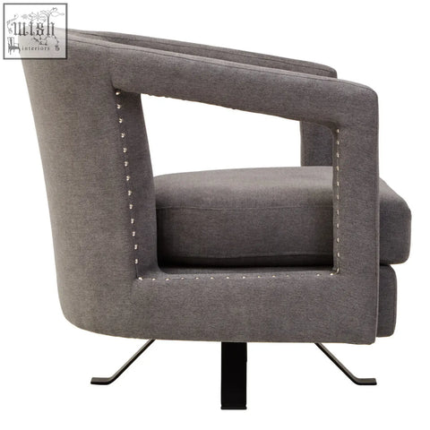 Gray hestia ash velvet swivel chair with nailhead trim and sleek black metal legs in modern design