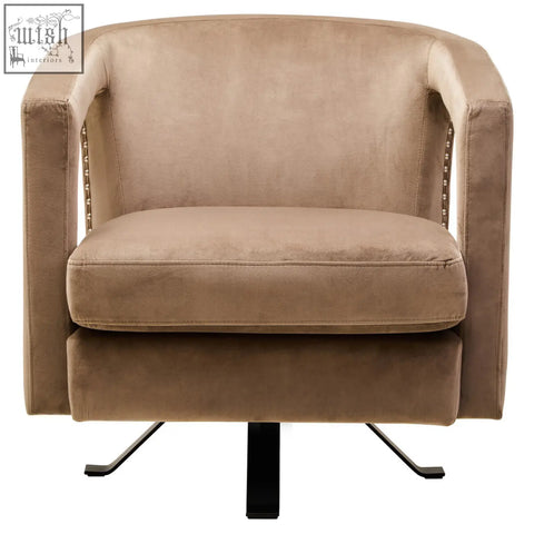 Beige hestia mink velvet swivel chair with metallic nailhead trim and black metal swivel base