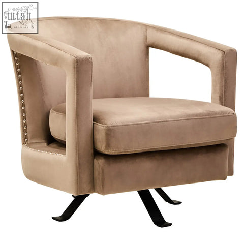 Beige hestia mink velvet swivel chair with studded accents and black metal legs for stylish comfort