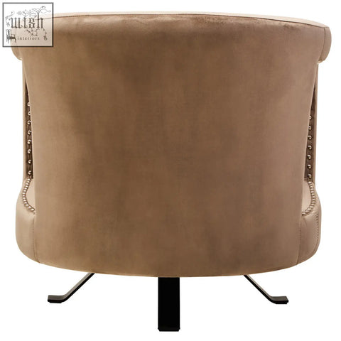 Beige hestia mink velvet swivel chair with tufted back silver nailhead trim and sleek black metal legs
