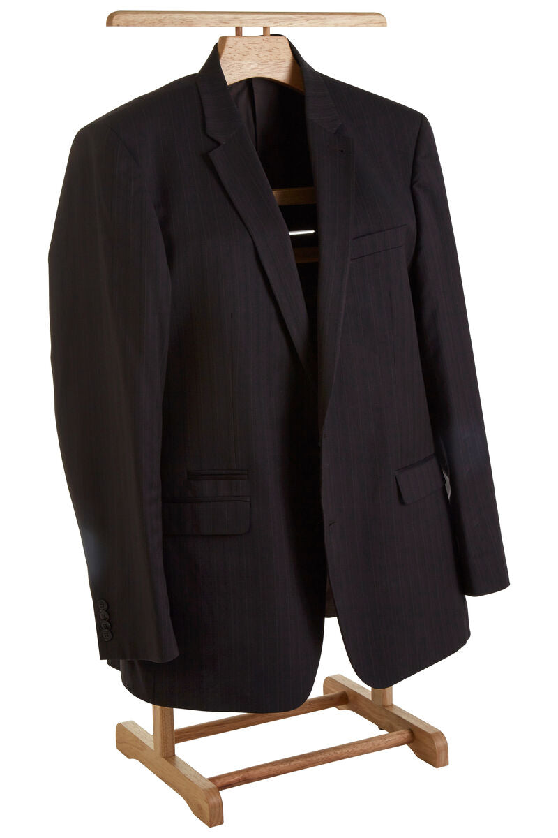 Black wool blazer hanging on a natural tropical hevea wood clothes valet rubberwood clothes valet rack
