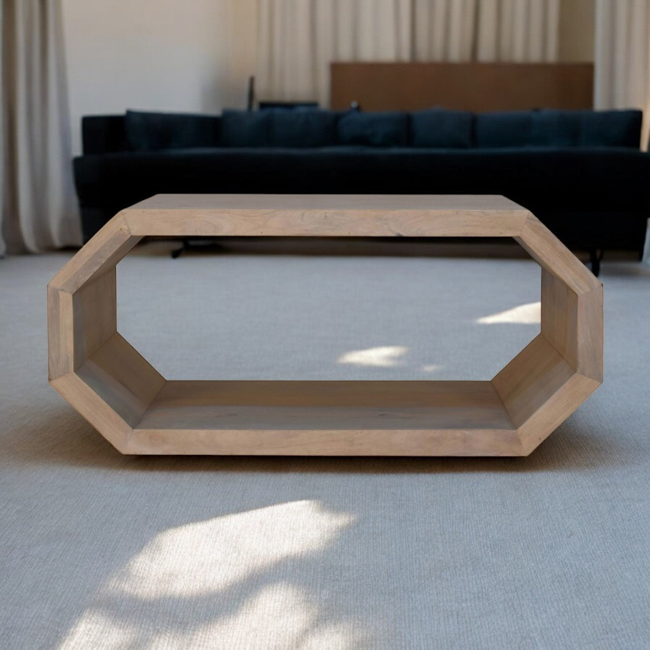 Light-colored wooden hexagonal coffee table with a hollow center and clean minimalist design for stylish living rooms