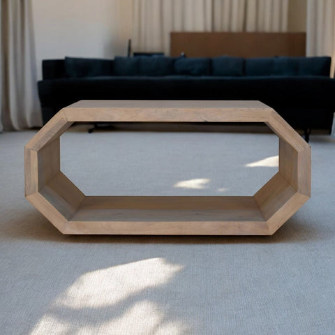 Light-colored wooden hexagonal coffee table with a hollow center and clean minimalist design for stylish living rooms