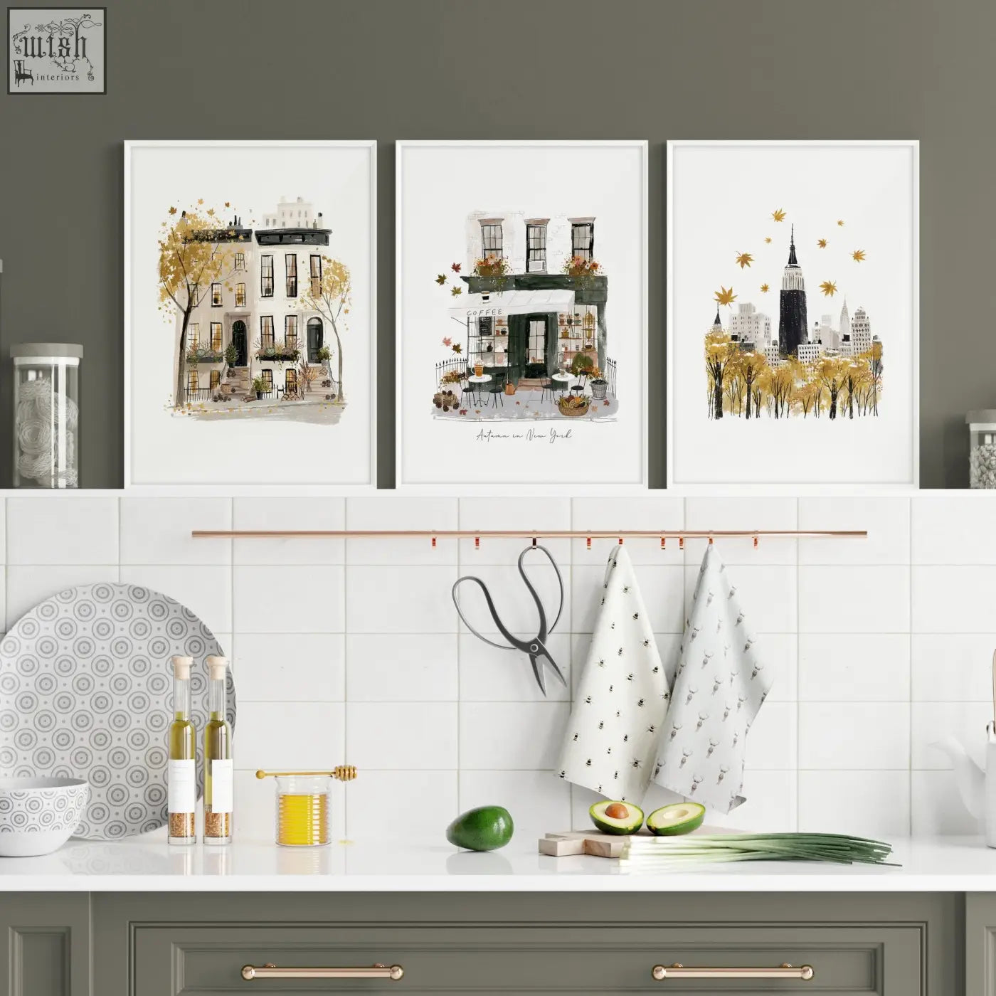 Three framed watercolor travel wall art prints of new york city scenes in autumnal ochre tones with golden leaves